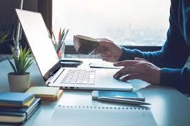 man at laptop drinking coffee